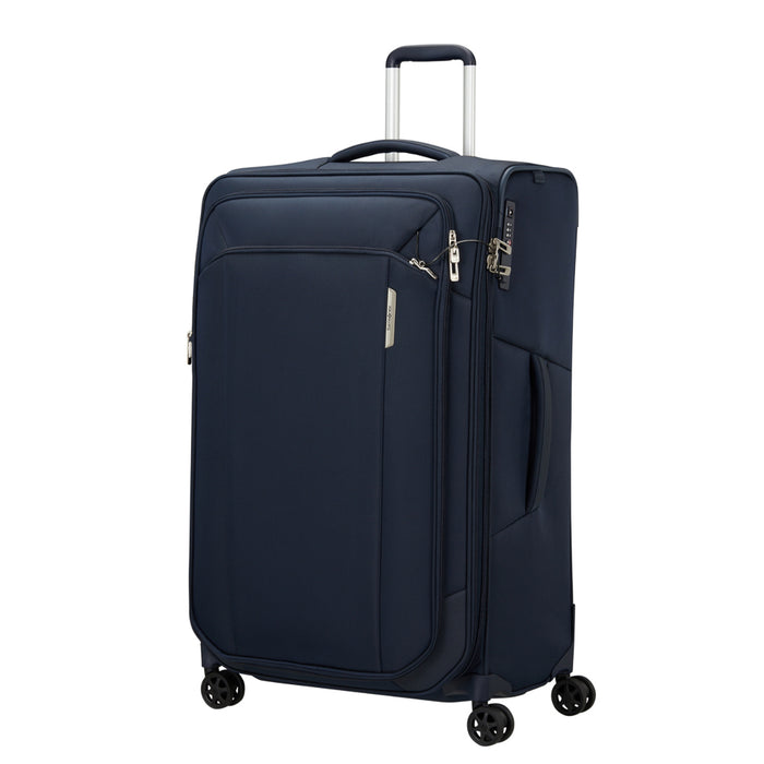 Midnight blue 79cm Samsonite Respark spinner suitcase with four wheels and a sleek design for easy travel.