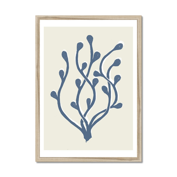 Framed art print featuring a handcrafted lino cut design of abstract seaweed in blue on a white background.