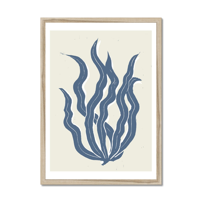 Framed art print featuring abstract indigo blue seaweed against a white background, presented in a simple wooden frame.