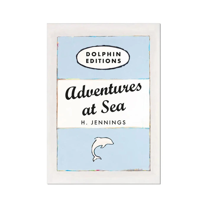 A framed art print of a vintage book cover titled 'Adventures at Sea' by H. Jennings, with a blue background and a small illustration of a dolphin.