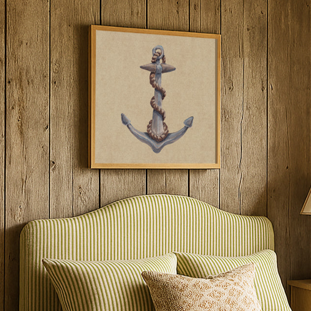 Green striped bed with decorative pillows against a wooden wall with an anchor painting above bed.