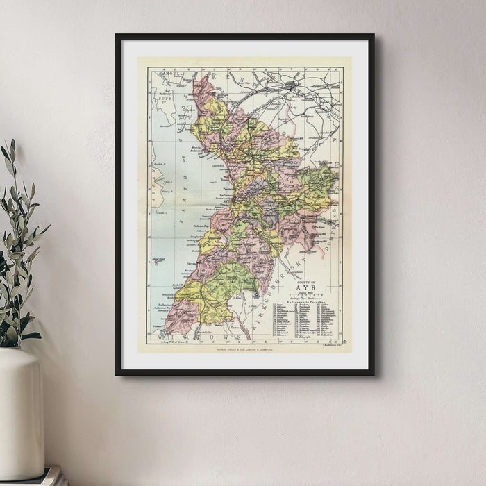 A framed vintage map print of Ayrshire, Scotland, with a black frame.