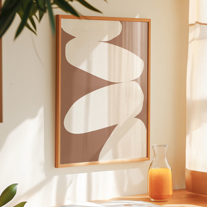 Abstract wall art print with white shapes on a mocha brown background, displayed on a wall in kitchen. Abstract balancing stones print.