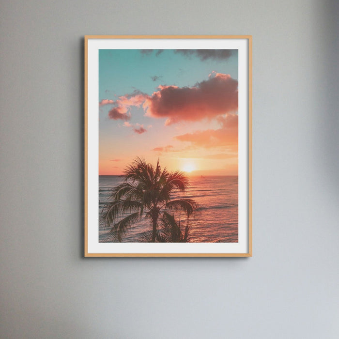 Beach Sunset Photography Print on wall with a wooden frame.