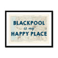 Framed Blackpool map print with the text 'BLACKPOOL is my HAPPY PLACE' overlayed on a map background within a black frame.