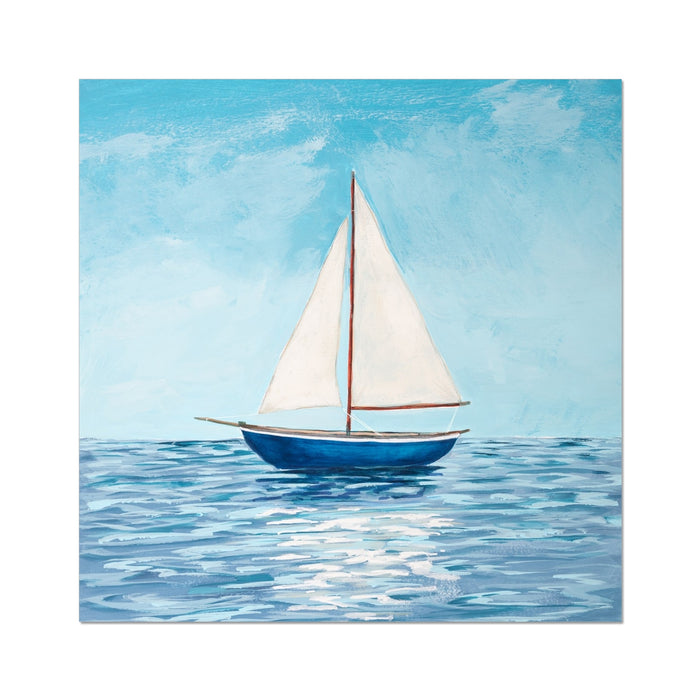 Sailboat on water with a blue sky background
