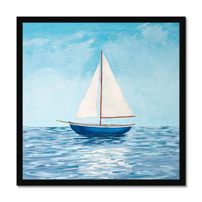 Framed artwork of a sailboat on water with a blue sky.