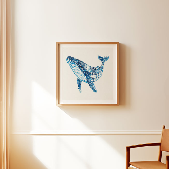 Framed blue whale painting with layered blue watercolour brushstrokes on a neutral background, framed in natural wood frame.