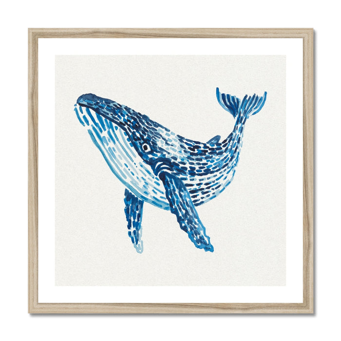 Framed artwork of a blue whale on a white background with natural wood frame