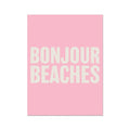 A framed word art print with the text 'BONJOUR BEACHES' in bold, white letters on a pink background.
