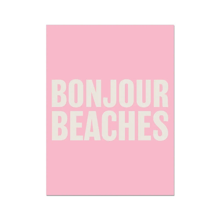 A framed word art print with the text 'BONJOUR BEACHES' in bold, white letters on a pink background.