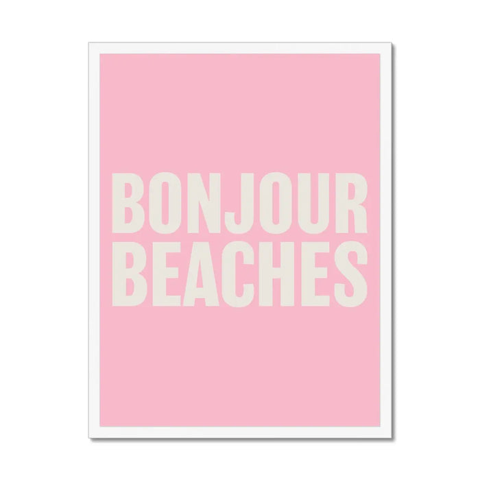 A framed word art print with the text 'BONJOUR BEACHES' in bold, white letters on a pink background.
