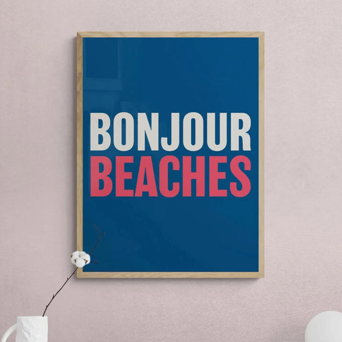 A colourful typography art print with the text 'BONJOUR BEACHES' in white and red against a navy blue background.