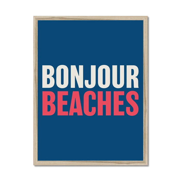 A colourful typography art print with the text 'BONJOUR BEACHES' in white and red against a navy blue background with wooden frame.