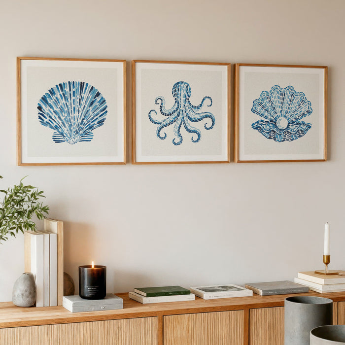 set of three sealife shell paintings on living room