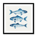 Framed artwork with blue fish illustrations on a white background