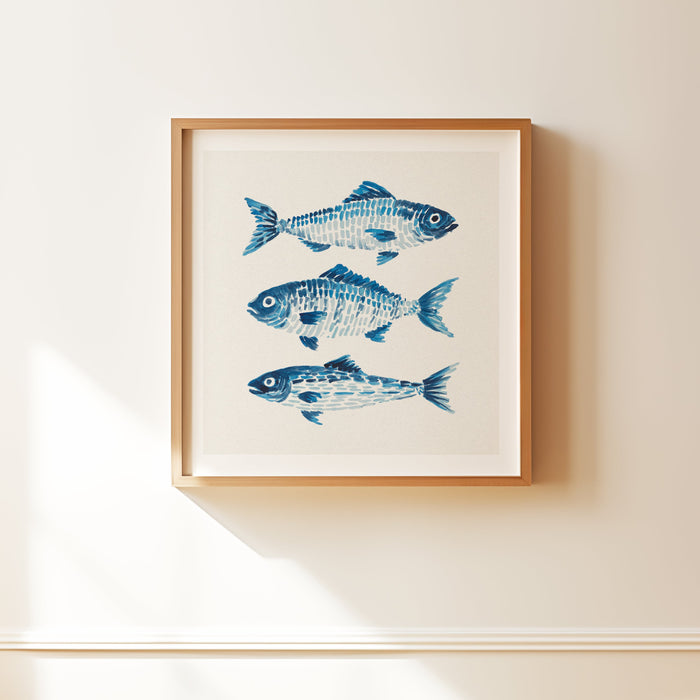 Watercolour painting of three fish in blue on wall