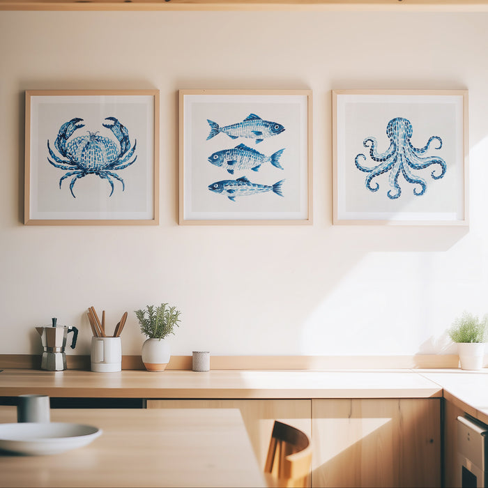 set of three blue sealife paintings on wall in kitchen. coastal wall art set