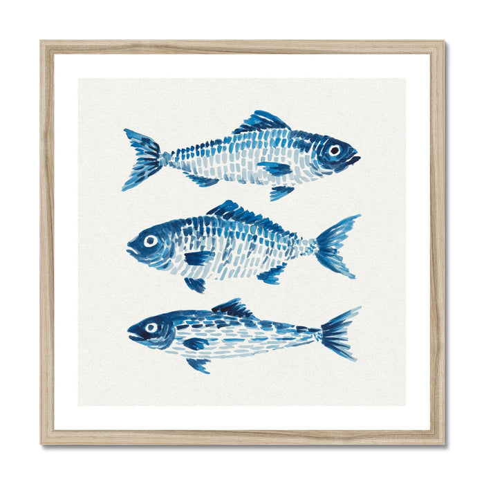 Framed artwork with blue fish illustrations on a white background