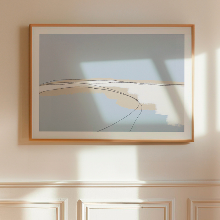 Framed abstract artwork on a wall with soft lighting