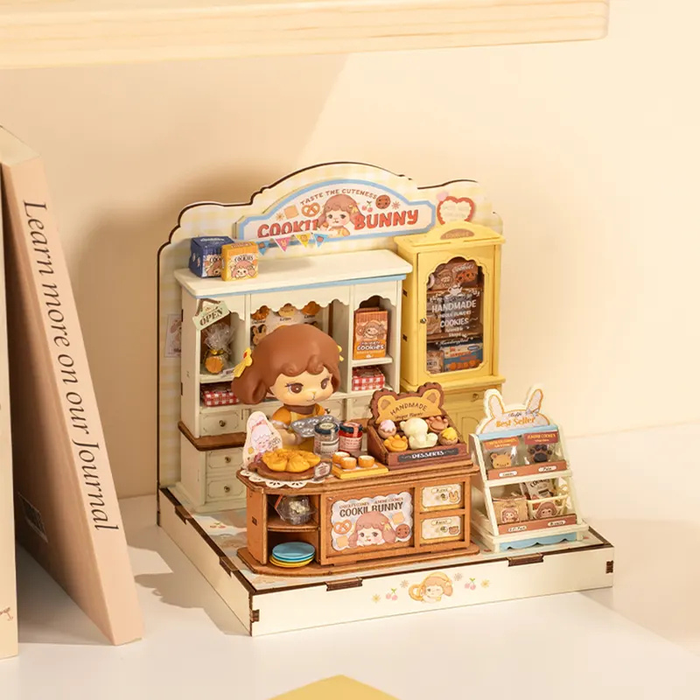 Miniature toy set with a character and various items on a shelf against a beige background.