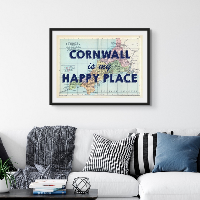 Cornwall map print. Framed cornwall map print above grey sofa in living room. Blue typography of cornwall is my happy place over the cornwall map
