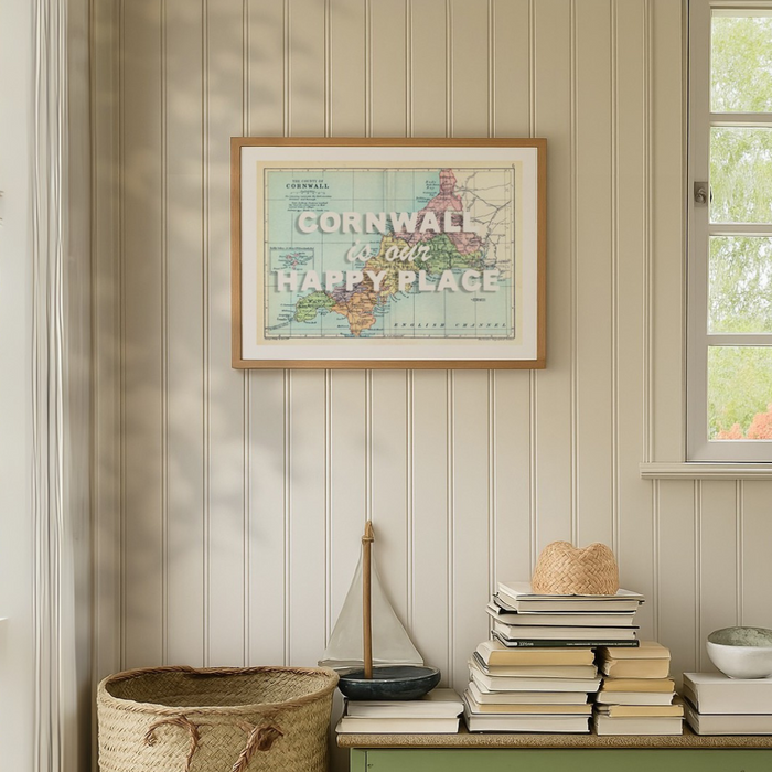 Vintage cornwall map print. framed custom map print of Cornwall hung on wall in hallway with panelling to walls.