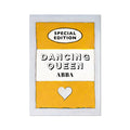 A print of a vintage book cover with the title 'Dancing Queen' by ABBA, predominantly yellow with black text, displayed on a white background.