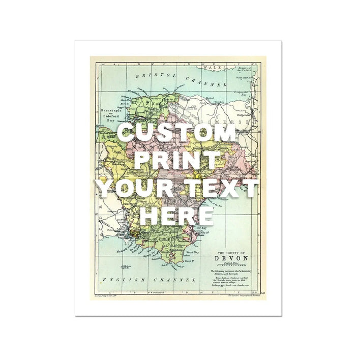 A custom Devon map print with a white hand-drawn font overlay, showing a Devon, England, with the text 'CUSTOM PRINT YOUR TEXT HERE'.