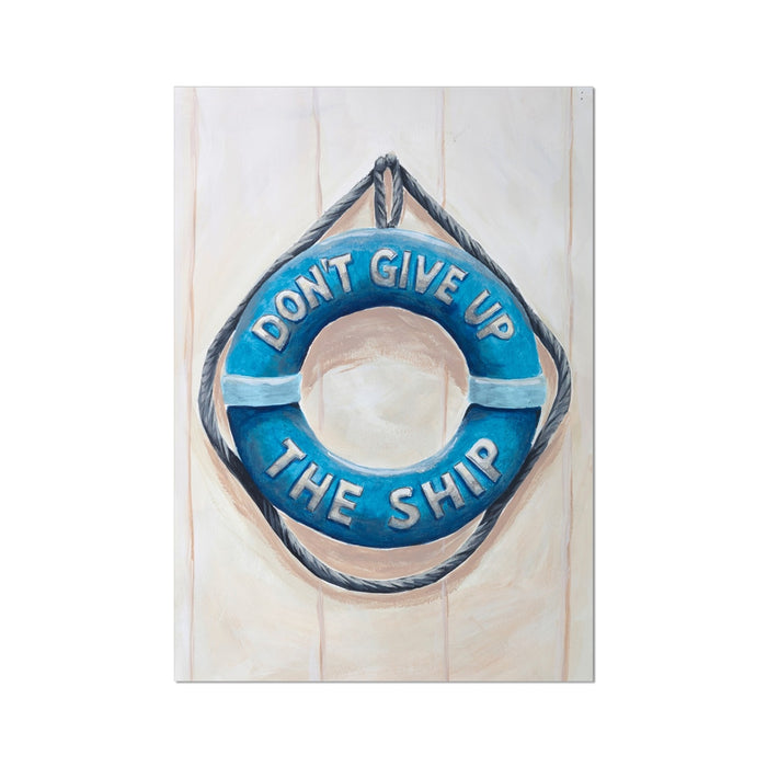 Blue life buoy with 'Don't Give Up The Ship' text on a wooden background