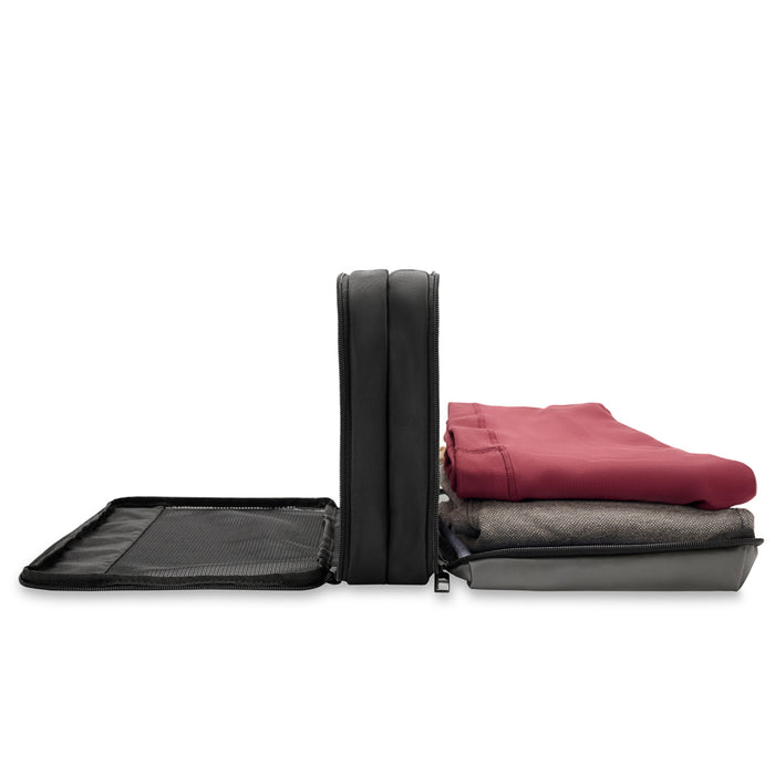 Briggs & Riley double-sided packing travel cube in black, showcasing organized compartments for efficient packing.