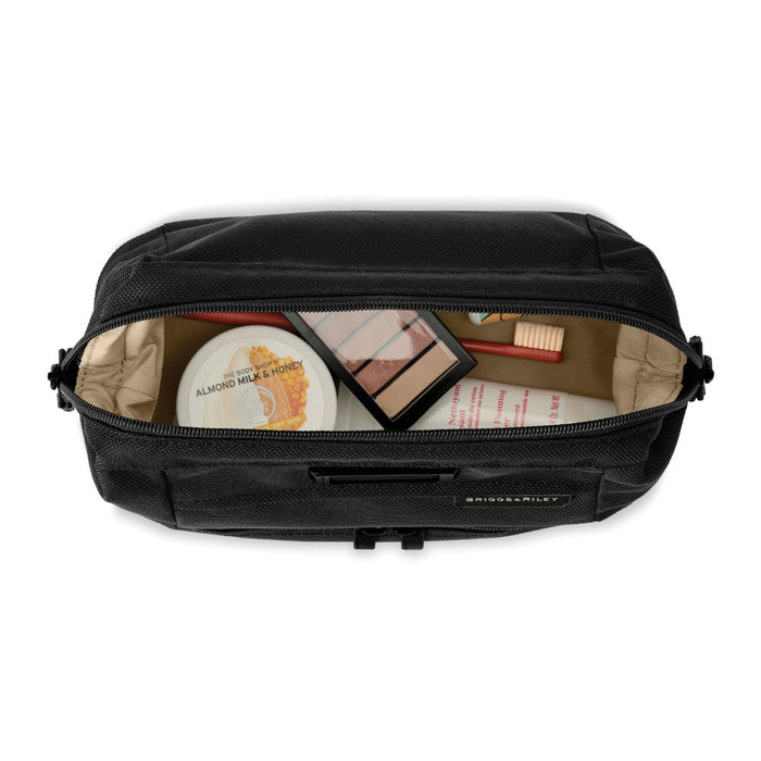 Briggs & Riley Duo Essential Kit in black, featuring sleek washbag design with zip closure and organized compartments.