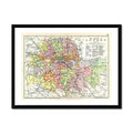 Framed vintage map print of London featuring a detailed, multi-coloured map enclosed in a black frame.