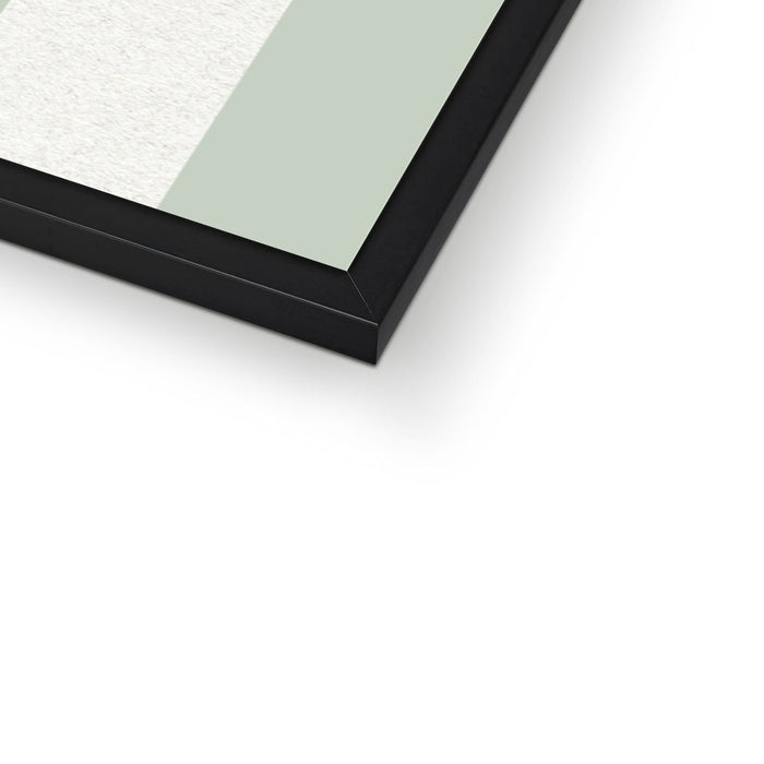 Close-up of a black-framed mirror on a white background