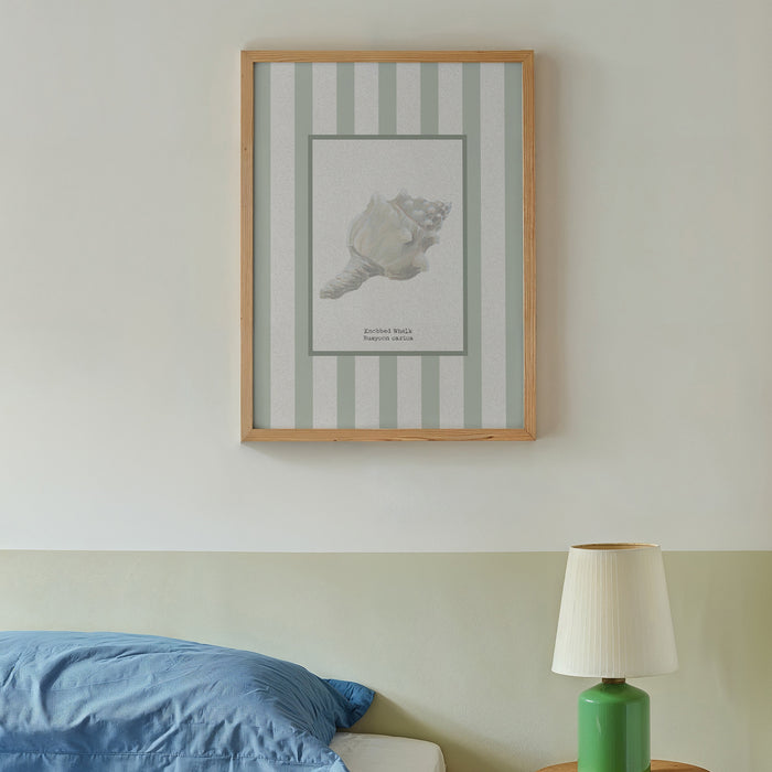 Conch shell art print on wall in bedroom.