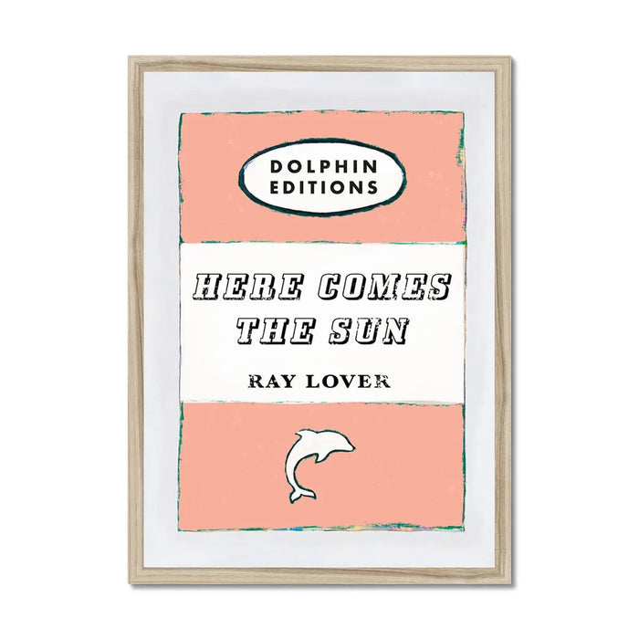 A framed art print of a vintage book cover with the title 'HERE COMES THE SUN' by RAY LOVER, featuring peach and white colours with a small graphic of a sun.