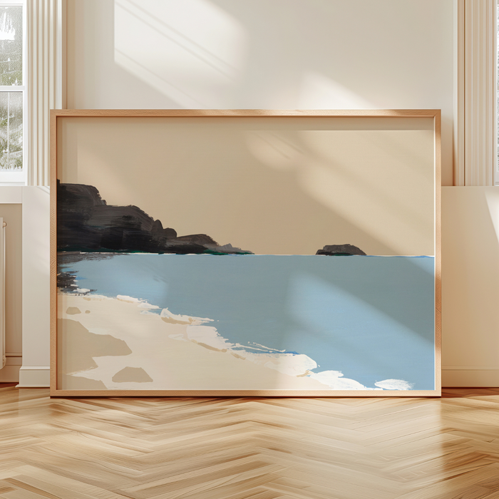Framed beach artwork on a wall with a neutral background. Coastal seascape painting