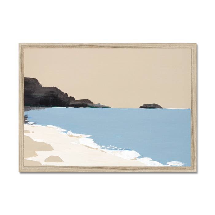 Framed artwork of a coastal scene with rocks and water.
