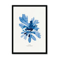 A framed art print featuring a blue watercolour painting of seaweed with a black frame, placed against a white background.