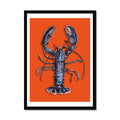 A framed print of a blue lobster on an orange background, designed as kitchen wall art. Black frame.
