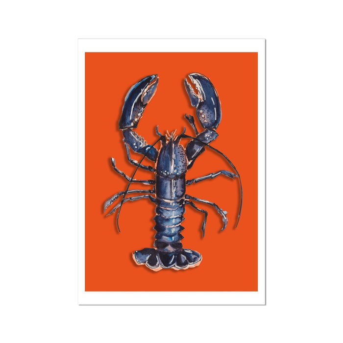 A framed print of a blue lobster on an orange background, designed as kitchen wall art.