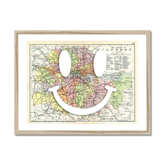 vintage map of London with a white smiley face on it in a natural frame - beach house art