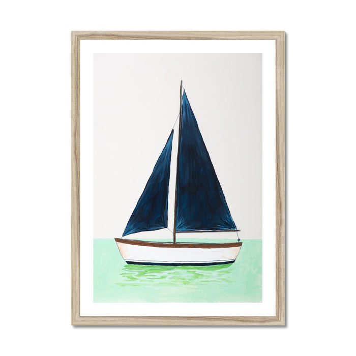 Framed artwork of a sailboat with blue sails on a light green background