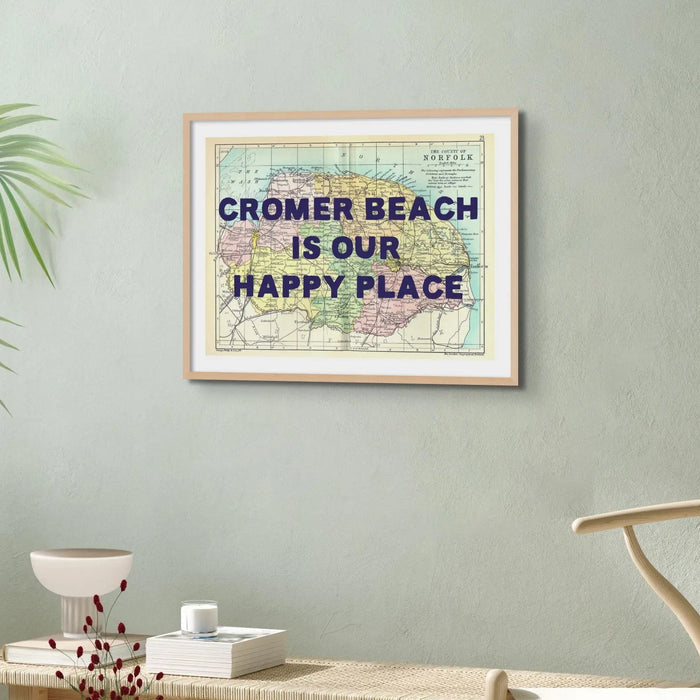 Coastal wall art featuring a personalised vintage map print of Norfolk with pink font - Framed wall art