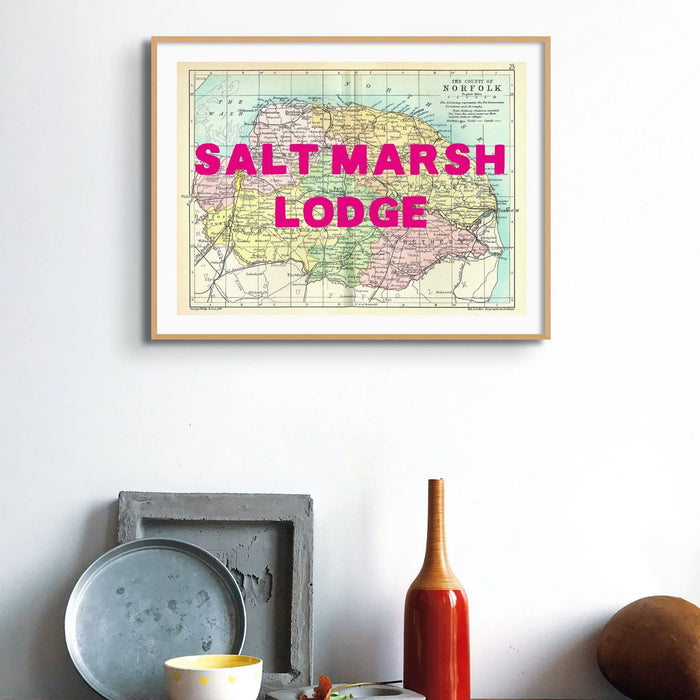 Coastal wall art featuring a personalised vintage map print of Norfolk with navy font - Framed Wall Art