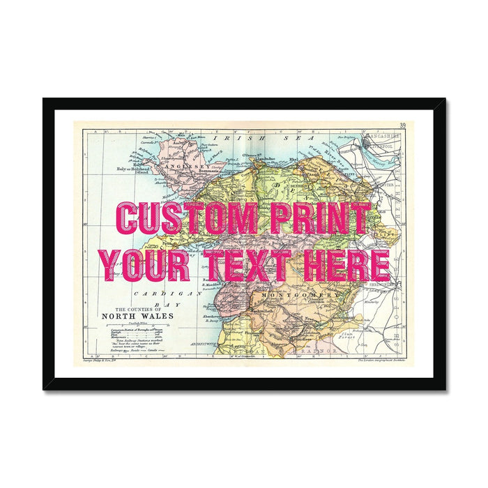 Framed art print of a vintage map of North Wales with a custom text placeholder in pink vintage font.