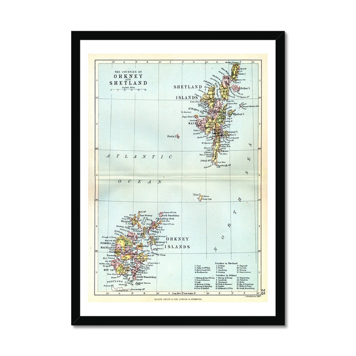 Framed vintage map print of the Orkney and Shetland Islands with a colorful detailed map inside a black frame.
