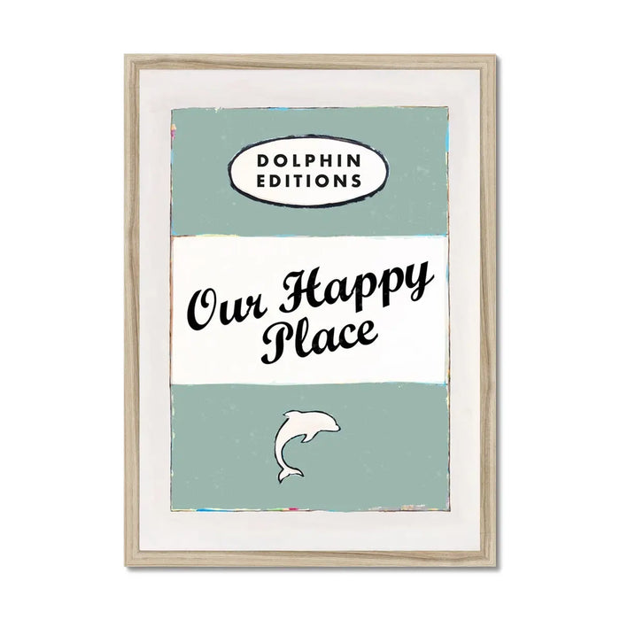 Framed art print featuring a vintage book cover style with the title 'Our Happy Place' and a small graphic of a dolphin, in a green colour scheme.