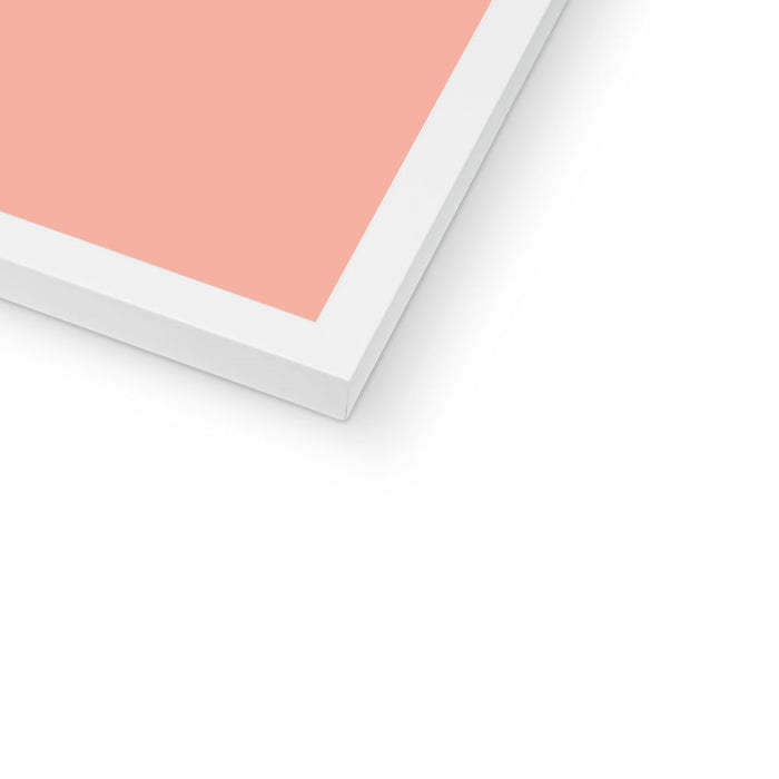 Framed artwork with a pink background on a white surface