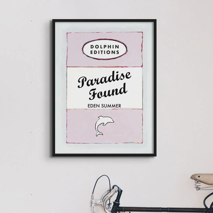 this framed print features a vintage book cover art poster of "Paradise Found" in pink.